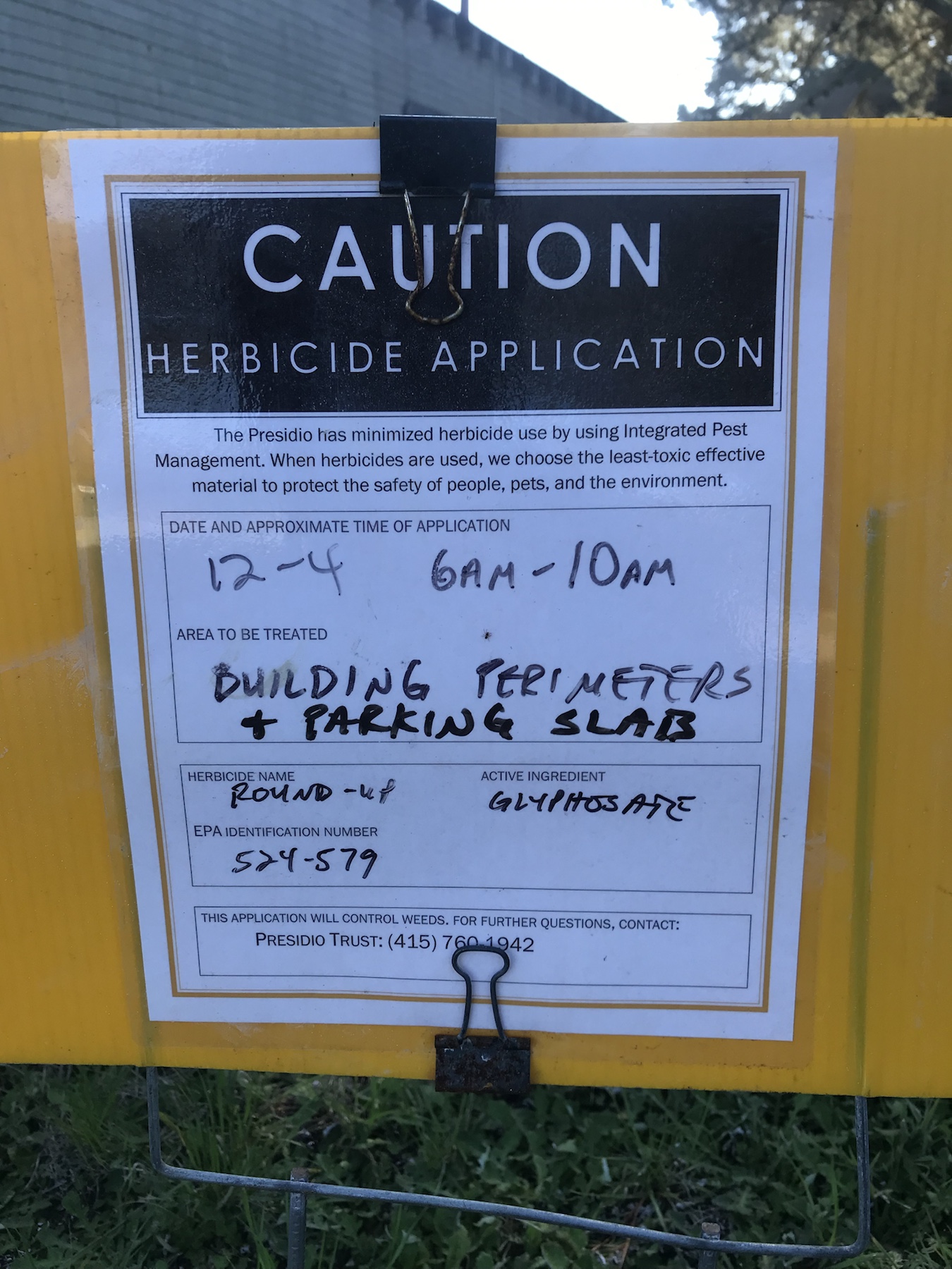 Caution herbicide application sign listing Roundup and glyphosate at Building 1369 in the Presidio
