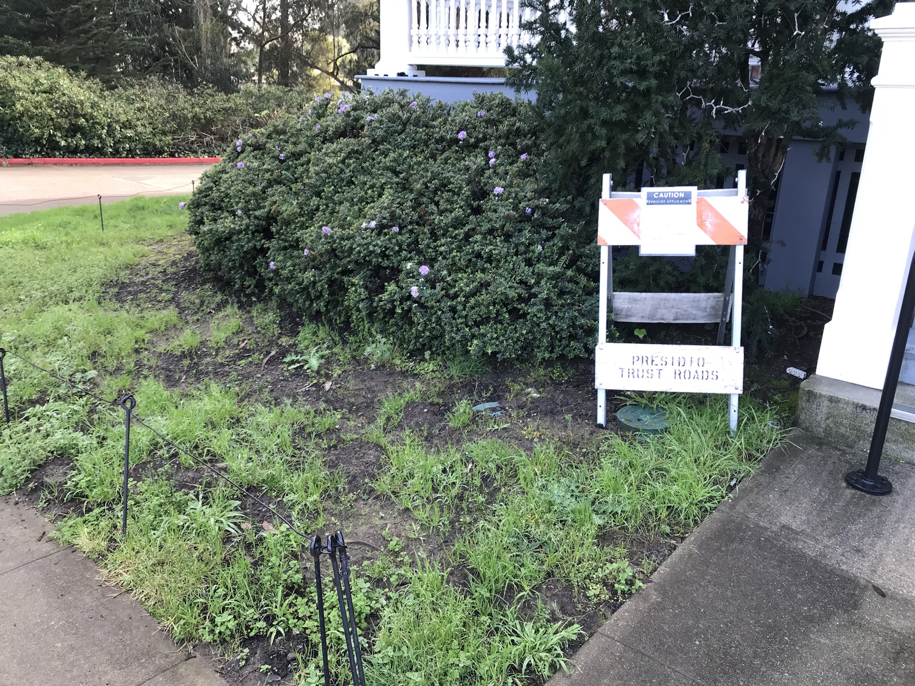 Context image of herbicide application sign by the Inn at the Presidio