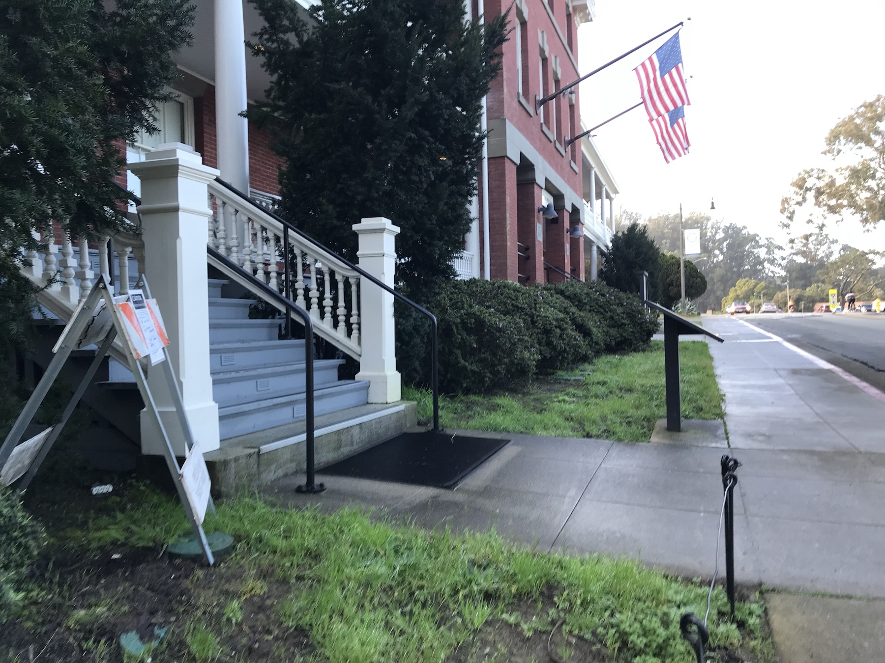 Inn at the Presidio frontage with herbicide application sign