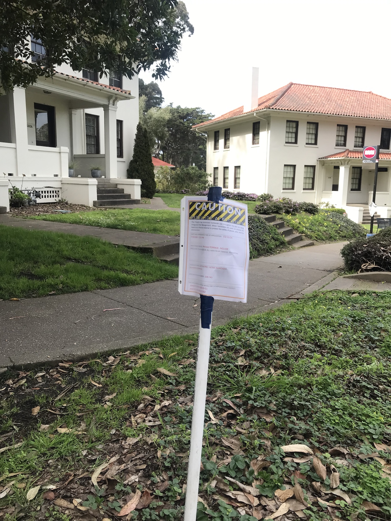 Herbicide application sign posted near Presidio Terrace buildings
