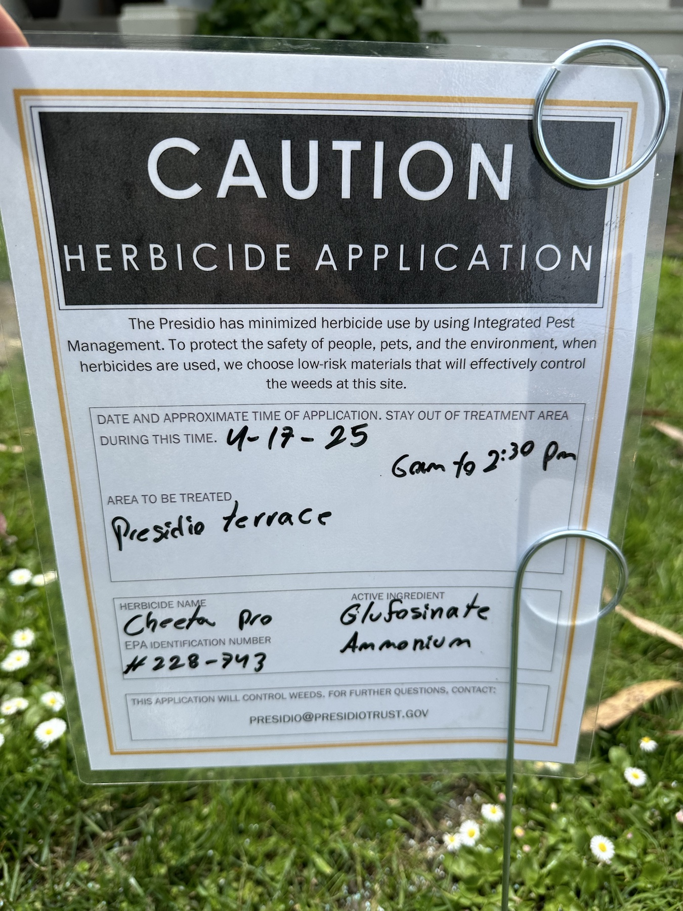 Close-up of a Cheetah Pro herbicide application sign at Presidio Terrace