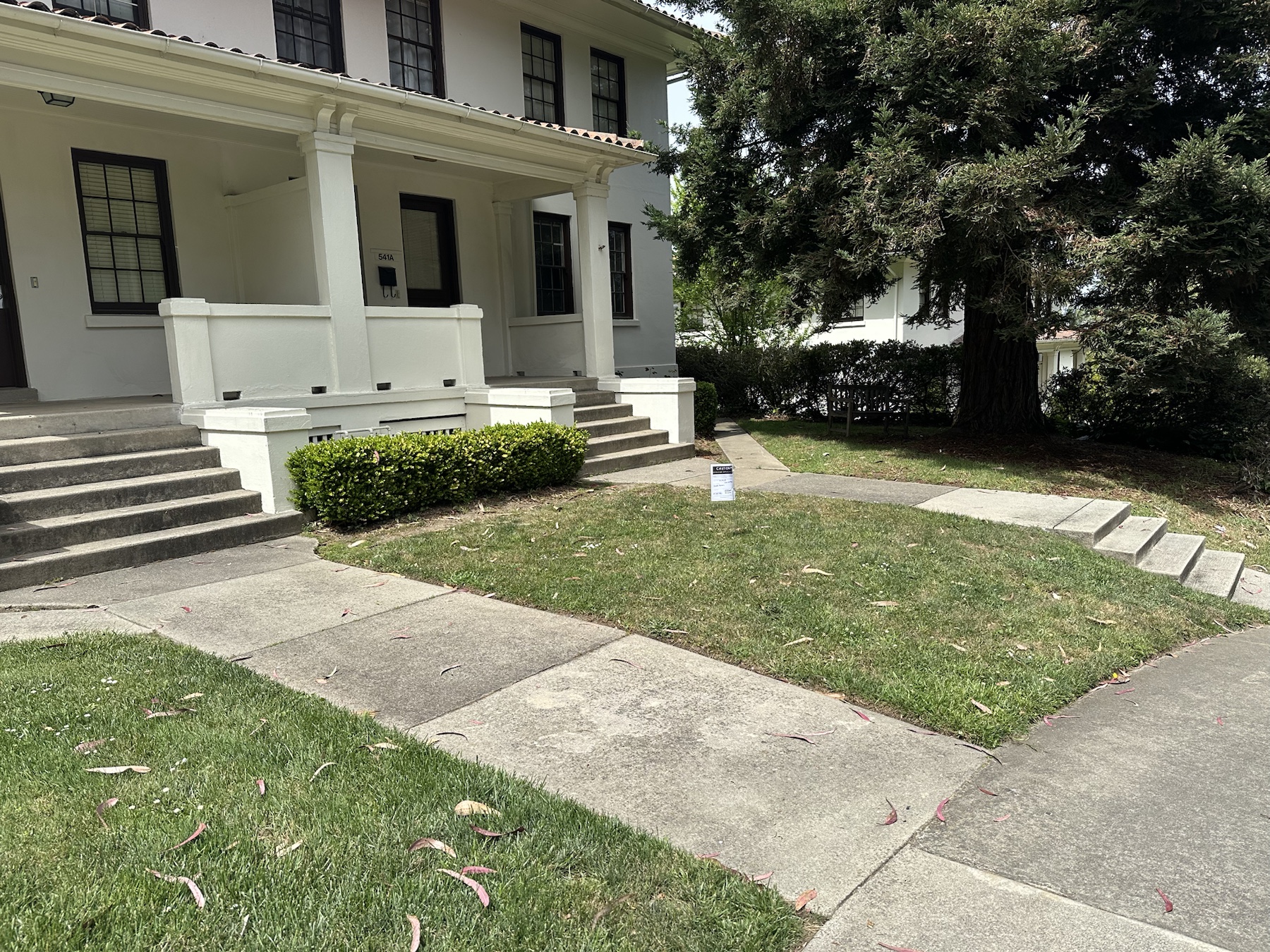 Context image of a herbicide application sign near Presidio Terrace building frontage