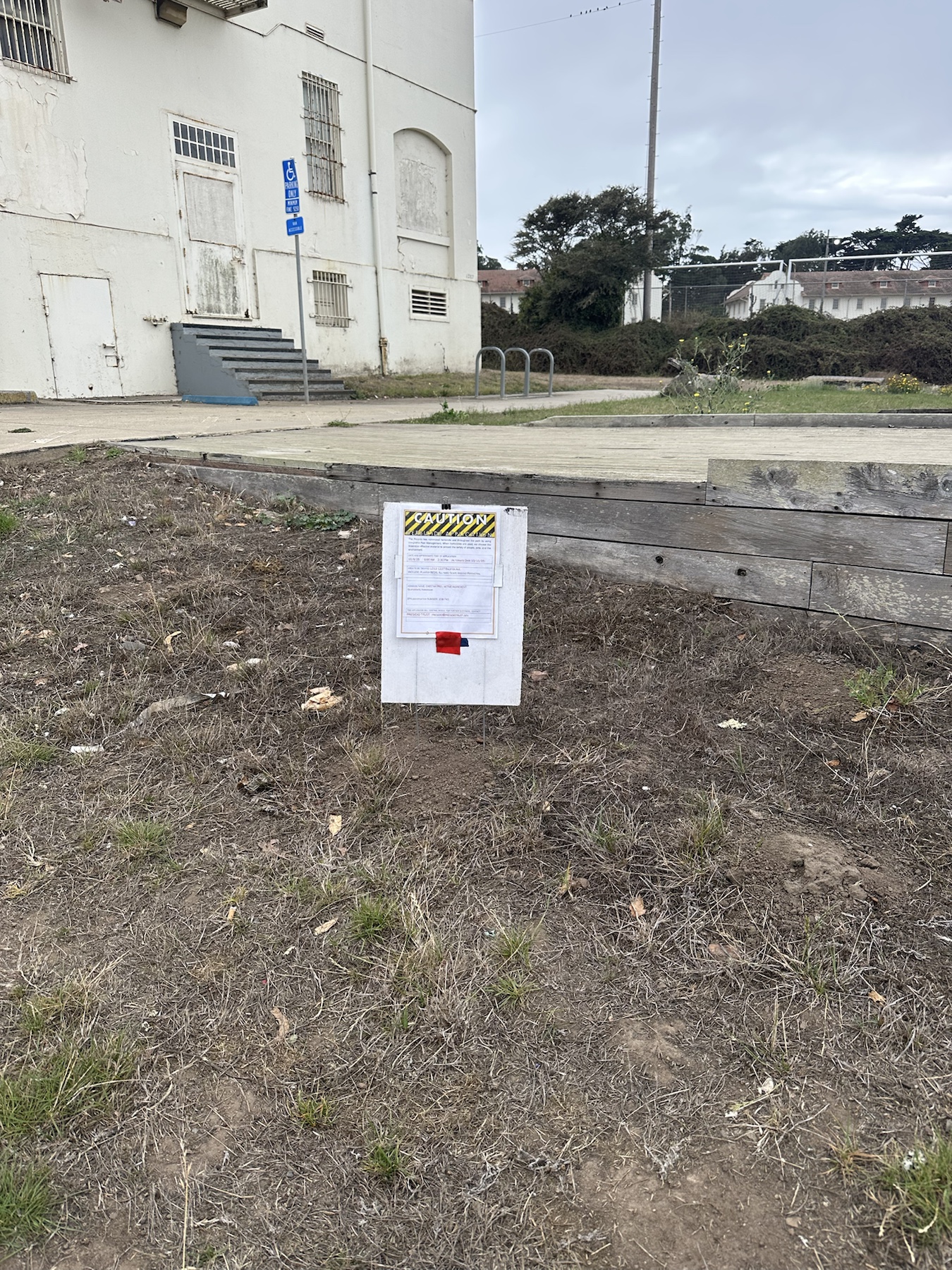 Context image of Cheetah Pro herbicide application sign near Ralston Ave buildings