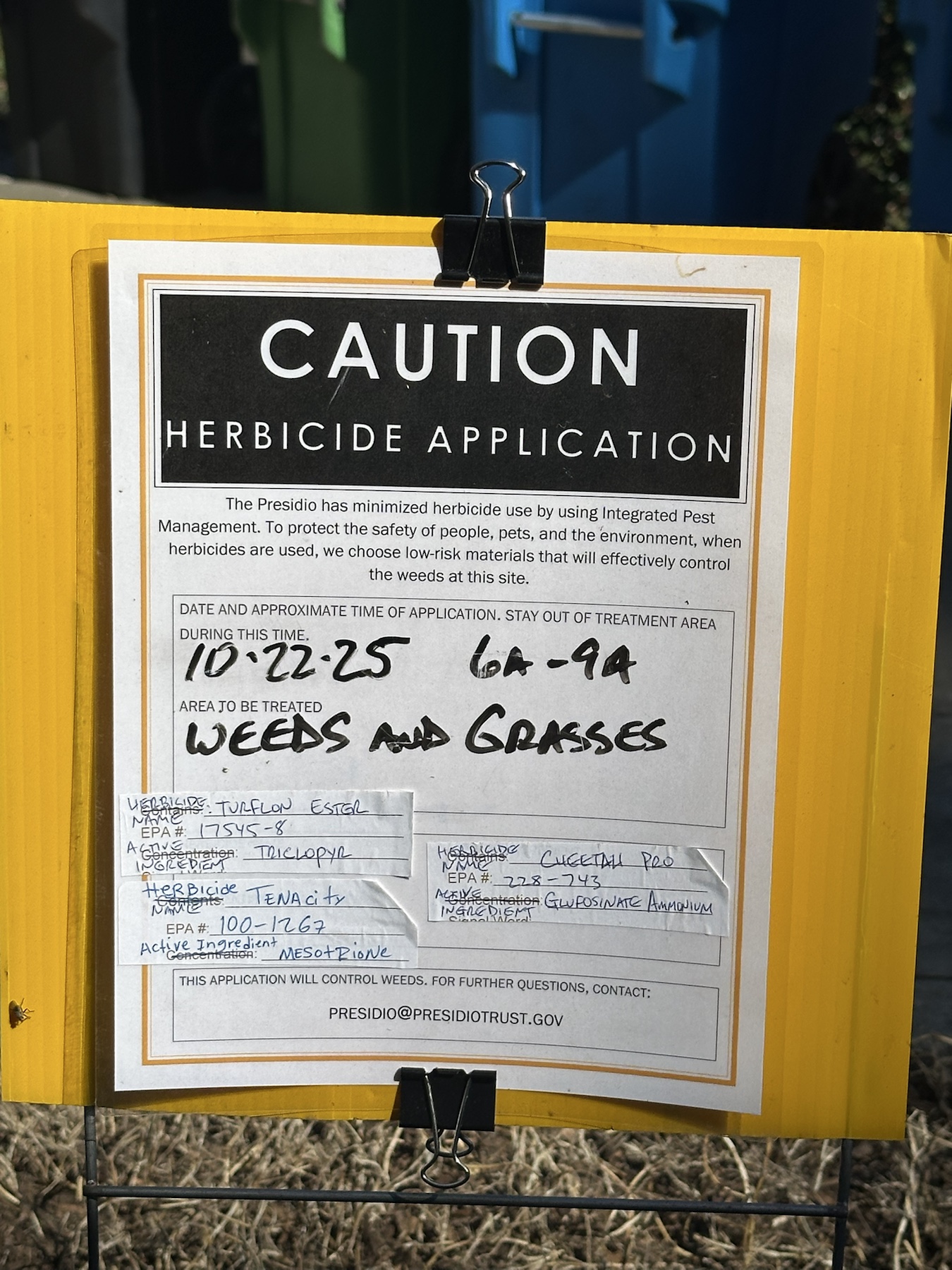 Caution herbicide application sign listing Turflon Ester Tenacity and Cheetah Pro for weeds and grasses