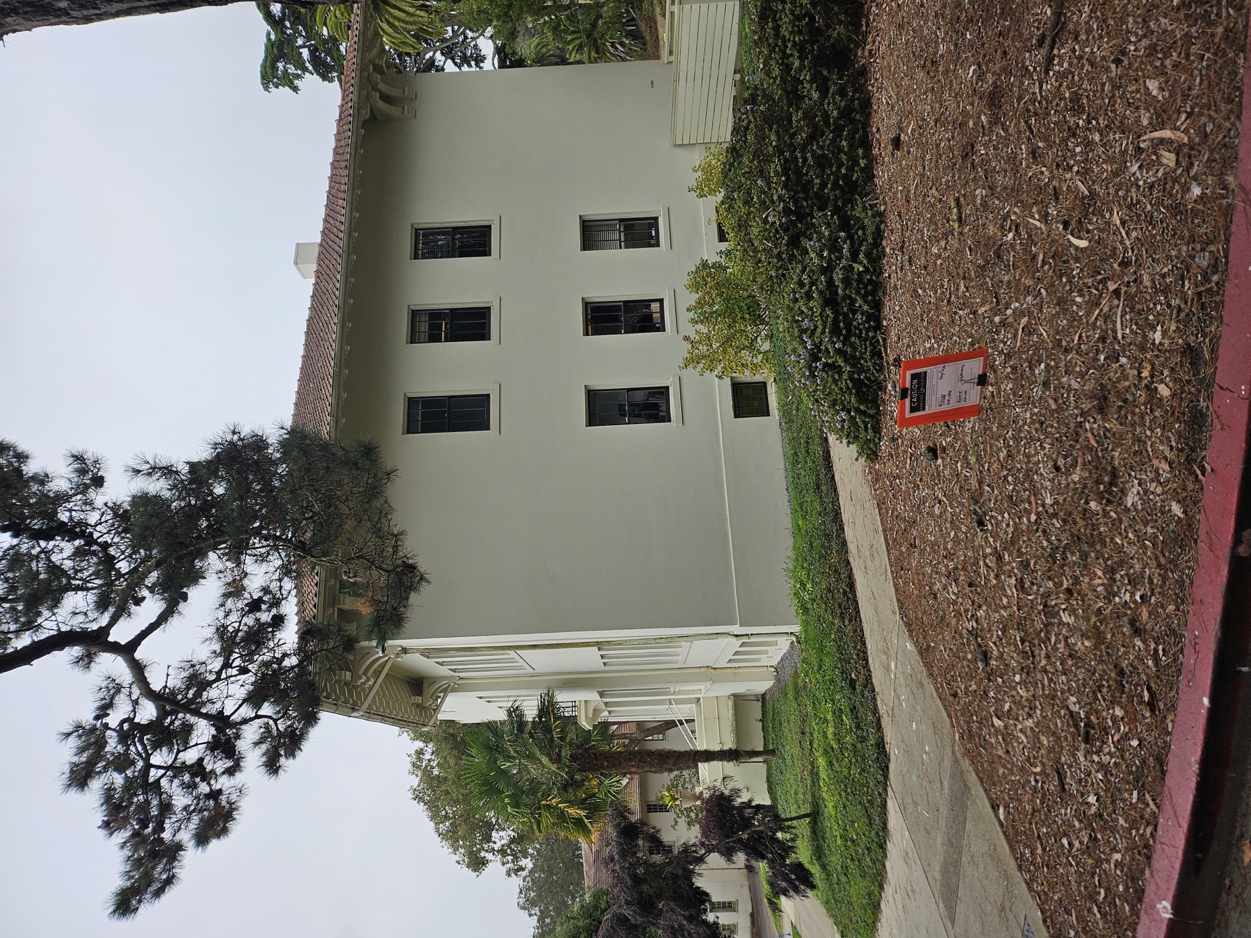 Roundup herbicide application sign posted in landscape area near Building 1201